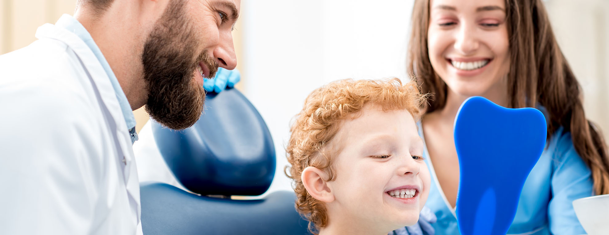 Pediatric dentist with child patient Pediatric dentist with child patient