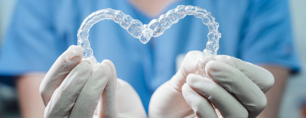 A heart shape made from Invisalign aligners